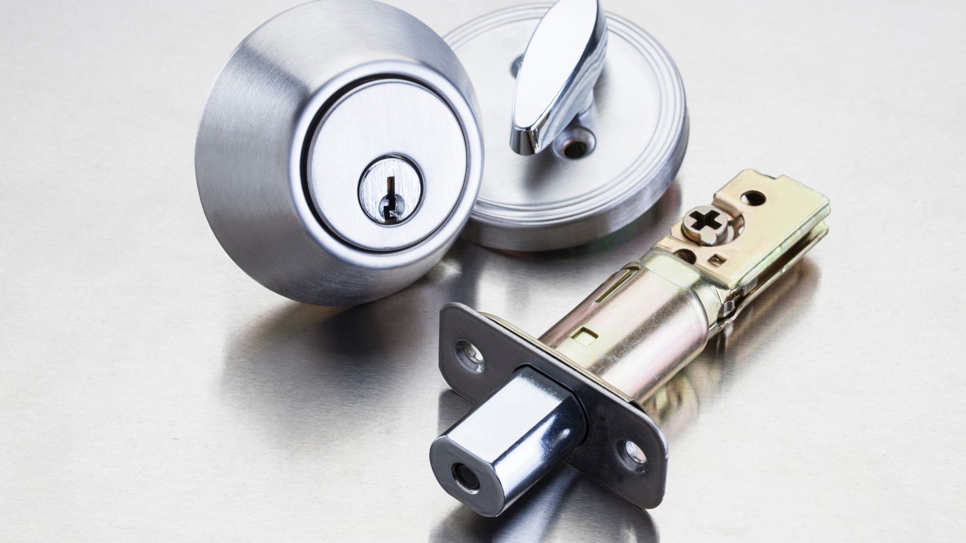 A close up of two different types of door knobs